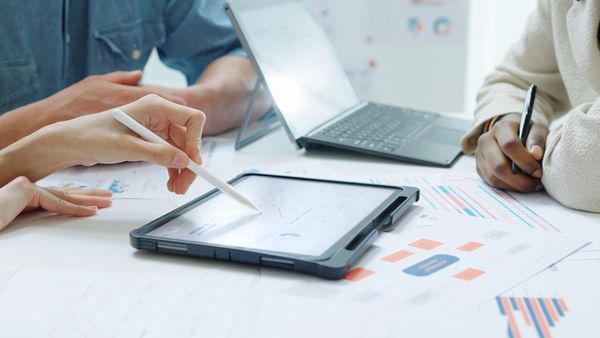 MOTM Media experts analyzing digital ads and growth data.