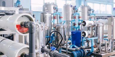 Industrial water treatment system with pipes and filtration units.