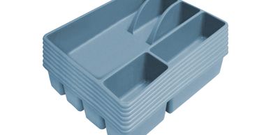Stack of blue plastic cutlery trays with multiple compartments.