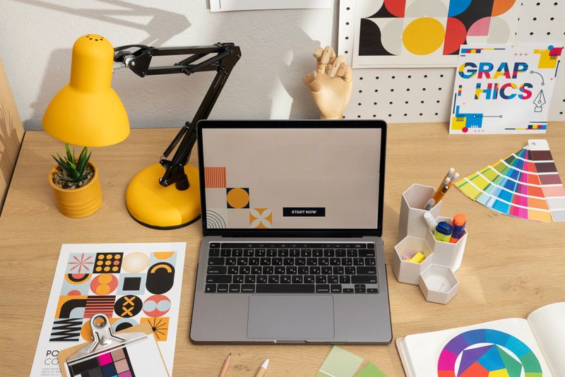 Designers Desktop with Color Palettes and Digital Screen. High quality photo