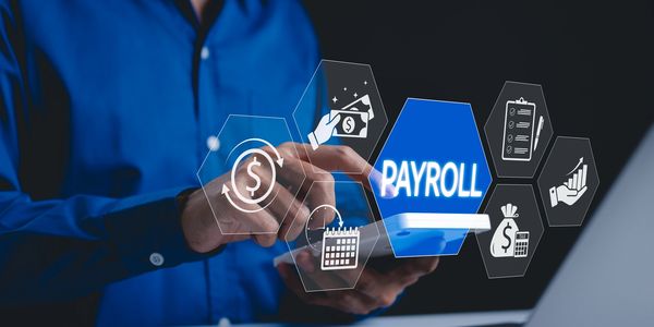 Person using digital payroll management interface on a tablet.