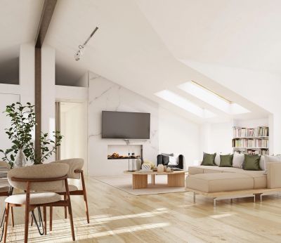 Bright modern living room with sloped ceiling and cozy seating.