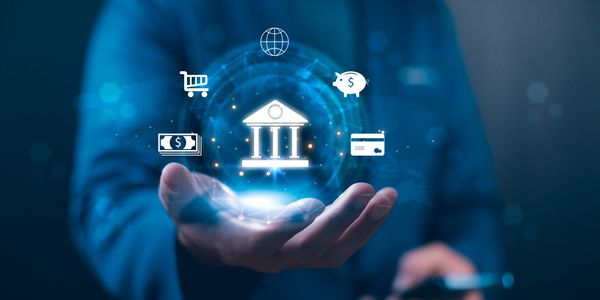 Hand holding digital banking and finance icons with a futuristic glow.