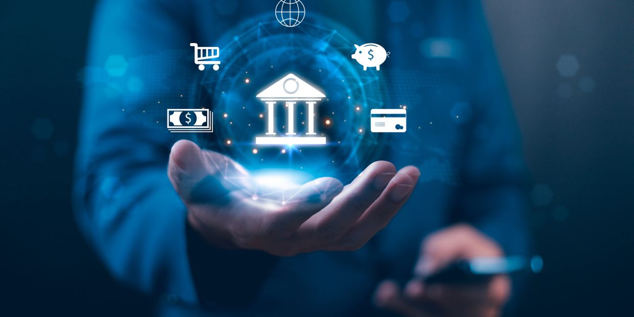 Hand holding digital banking and finance icons.