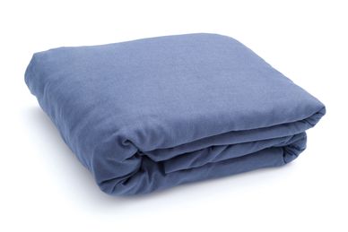 Folded blue blanket on a white background.