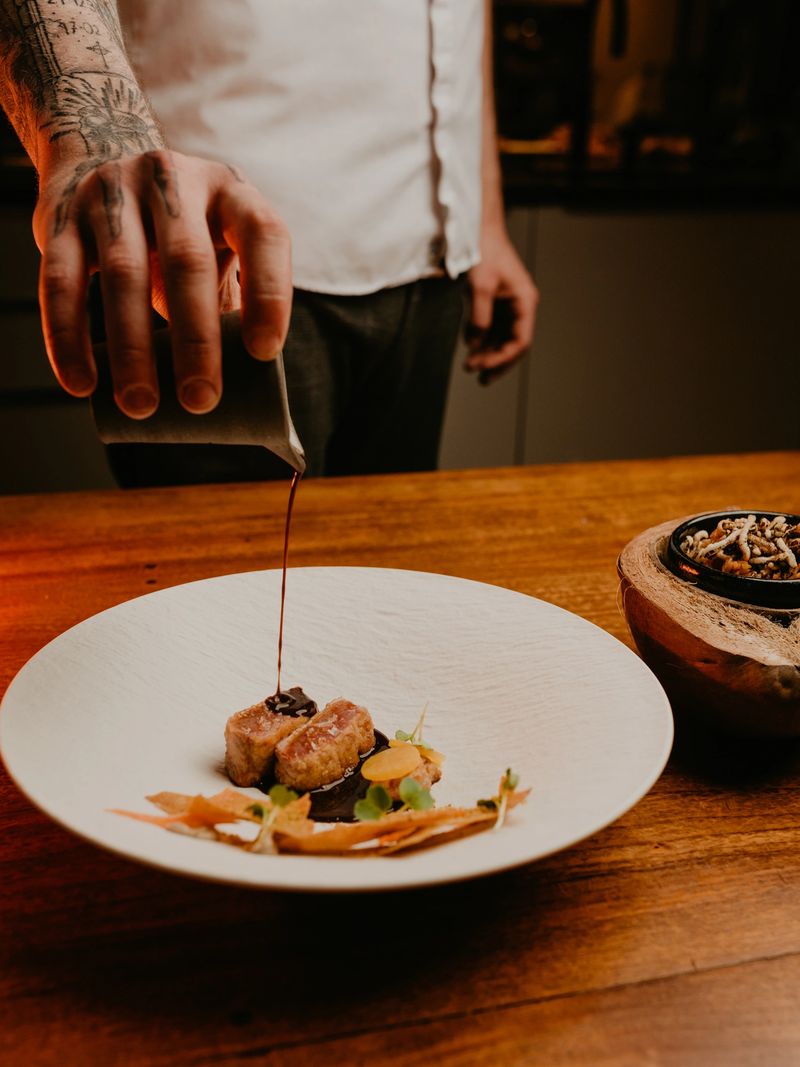 serving original dishes of haute cuisine in Michelin-starred restaurants. modern presentation of food in catering establishments. close-up view directly from above of plate with various author dishes