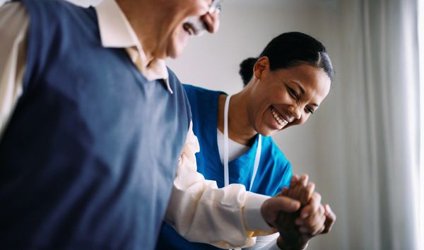 Doctor comforting a patient during consultation.