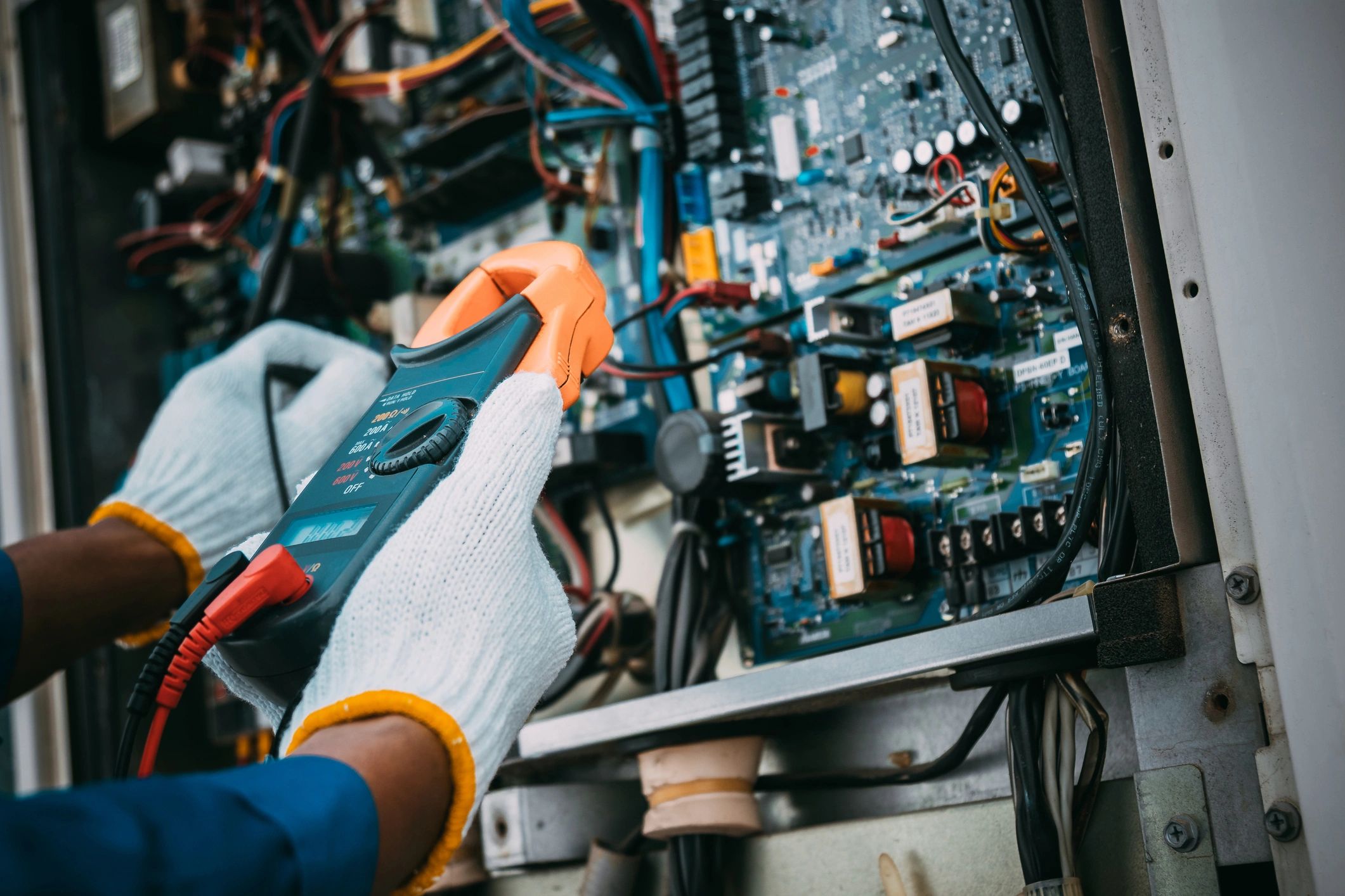 HVAC Technician with voltage meter