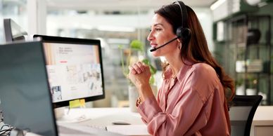 Woman at a computer screen on a call