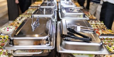 Buffet setup with chafing dishes and food platters.