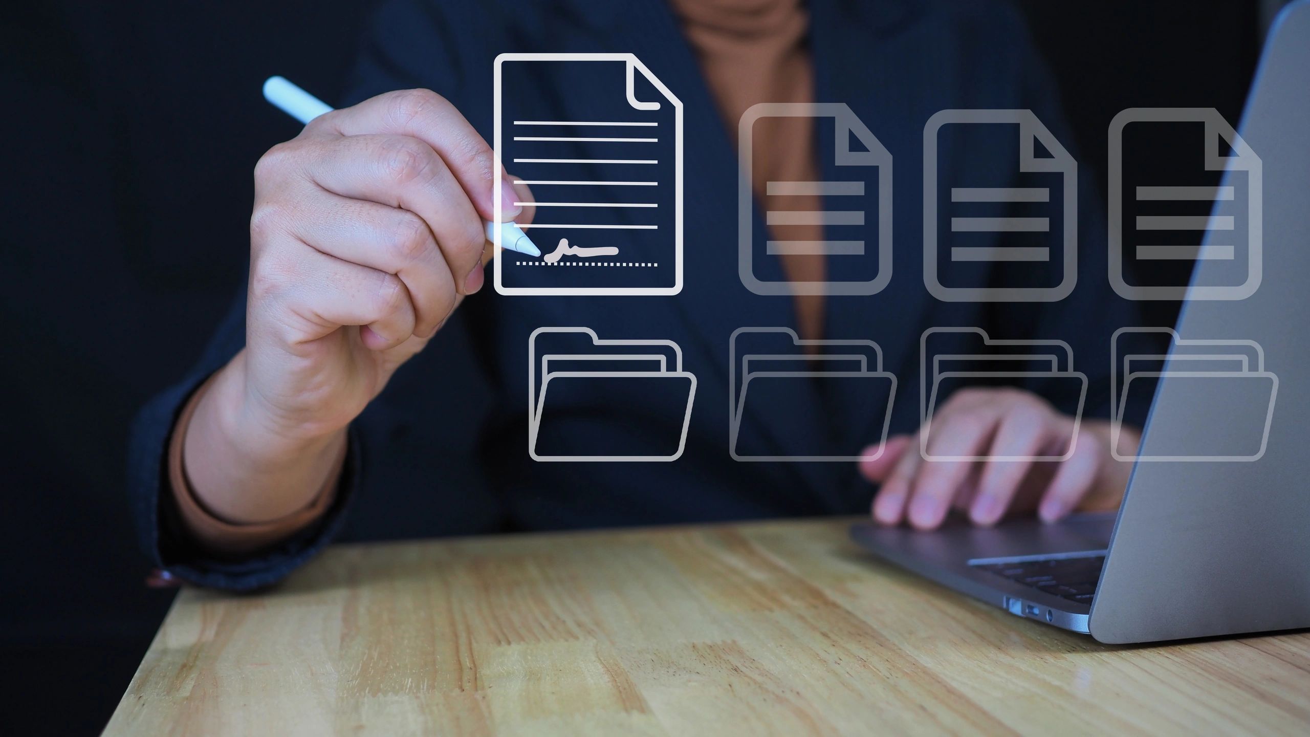 Person digitally signing a document on a laptop with virtual file icons.