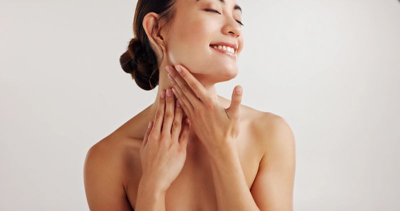 Thinking, woman and relaxing with skincare in studio of facial treatment, dermatology and transformation glow. Happy, girl and natural beauty, organic cosmetic and aesthetic shine on white background