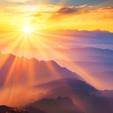 Sunrise over misty mountains.