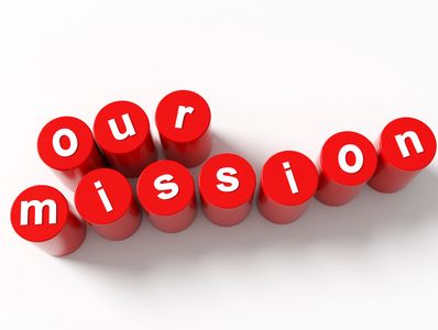 Red cylinders spelling out 'our mission'.