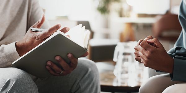 social worker supporting asylum seeker refugee in assessment