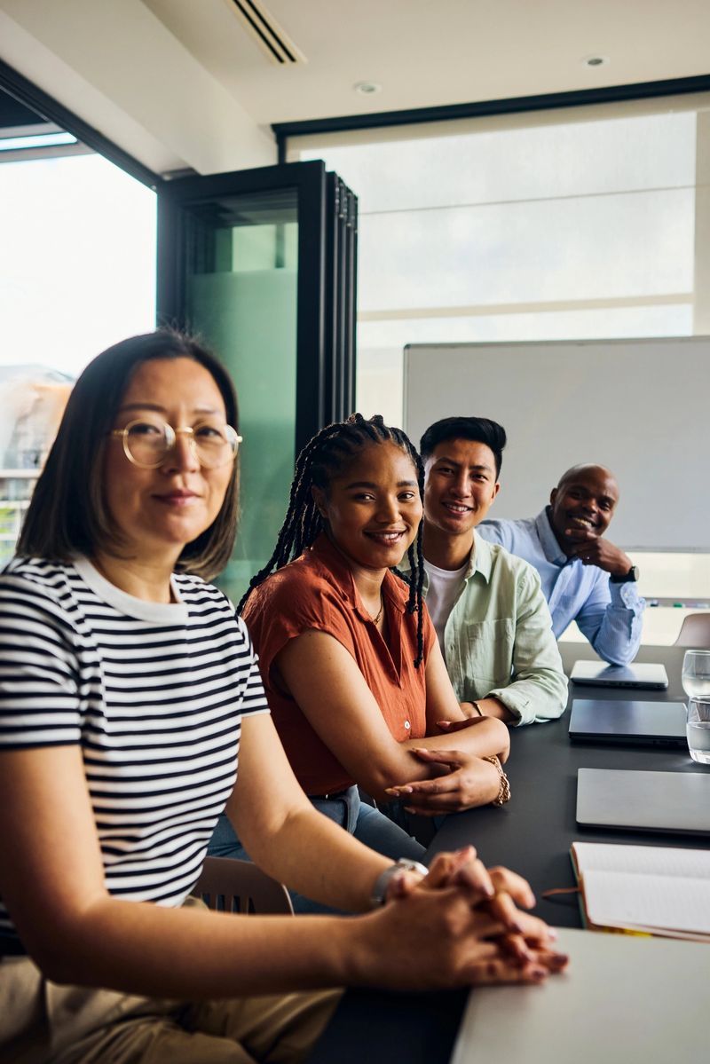 Diverse team of software engineers collaborating on ai development, showcasing teamwork and expertise in modern workplace