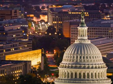 The illuminated dome of the U.S. Capitol at dusk in Washington, D.C.