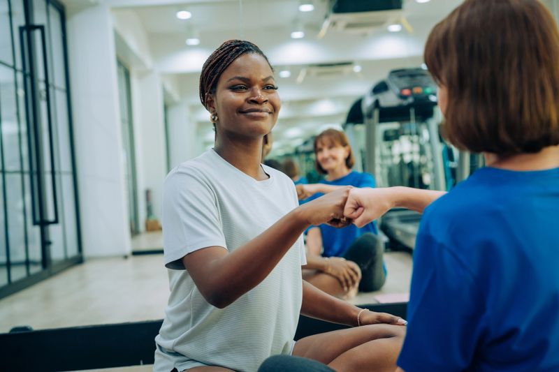 Empowering Women Engaged in Wellness and Teamwork at the Gym