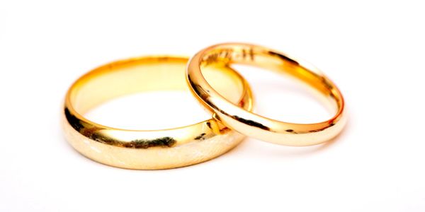 Two gold wedding rings symbolizing unity and commitment.