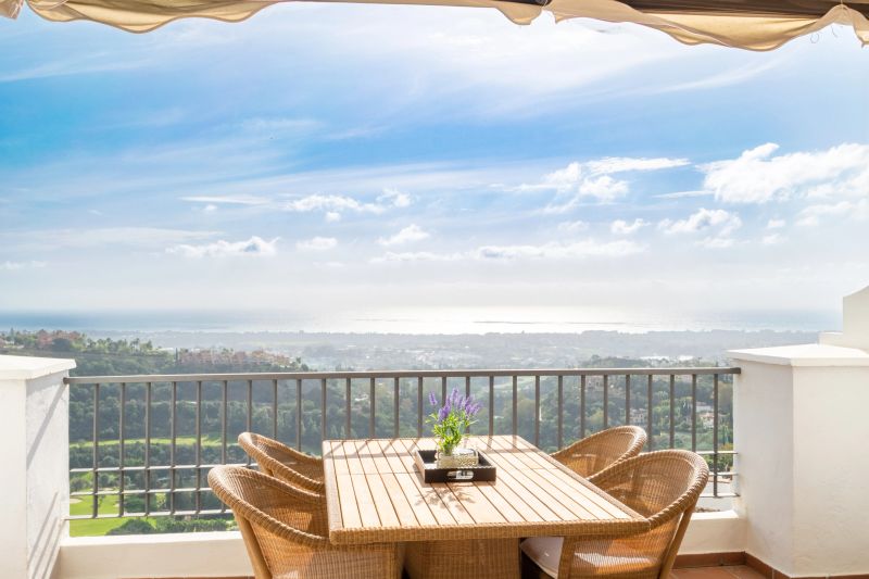 A landscape view overlooking the Mediterranean town of Marbella from a luxury apartment
