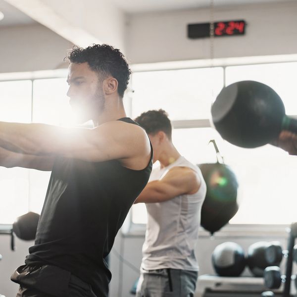 A man is working out in gym seriously