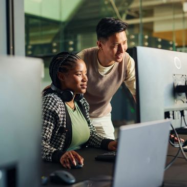 two colleagues looking at a computer screen