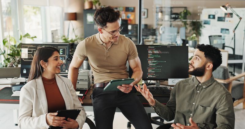 Programmer, teamwork and research with business people in office for website developer, coding bootcamp and review. Mentor, collaboration and software engineer with group of employees in tech startup