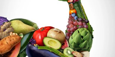 A colorful peacock made entirely of various fruits and vegetables.
