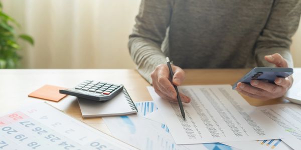 Man struggling with accounting paperwork