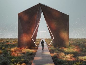 Person walking through geometric metal arches in a desert.