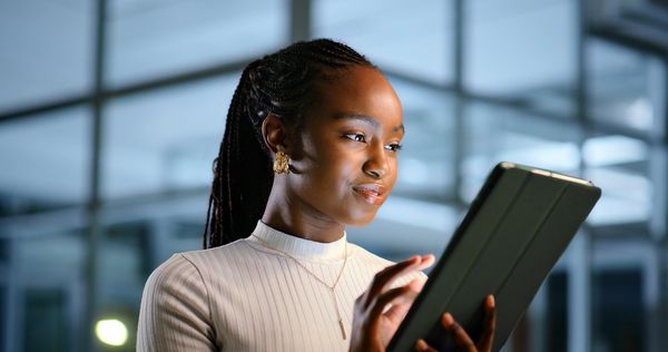 Woman using a tablet indoors.