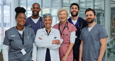 A diverse group of healthcare professionals smiling.