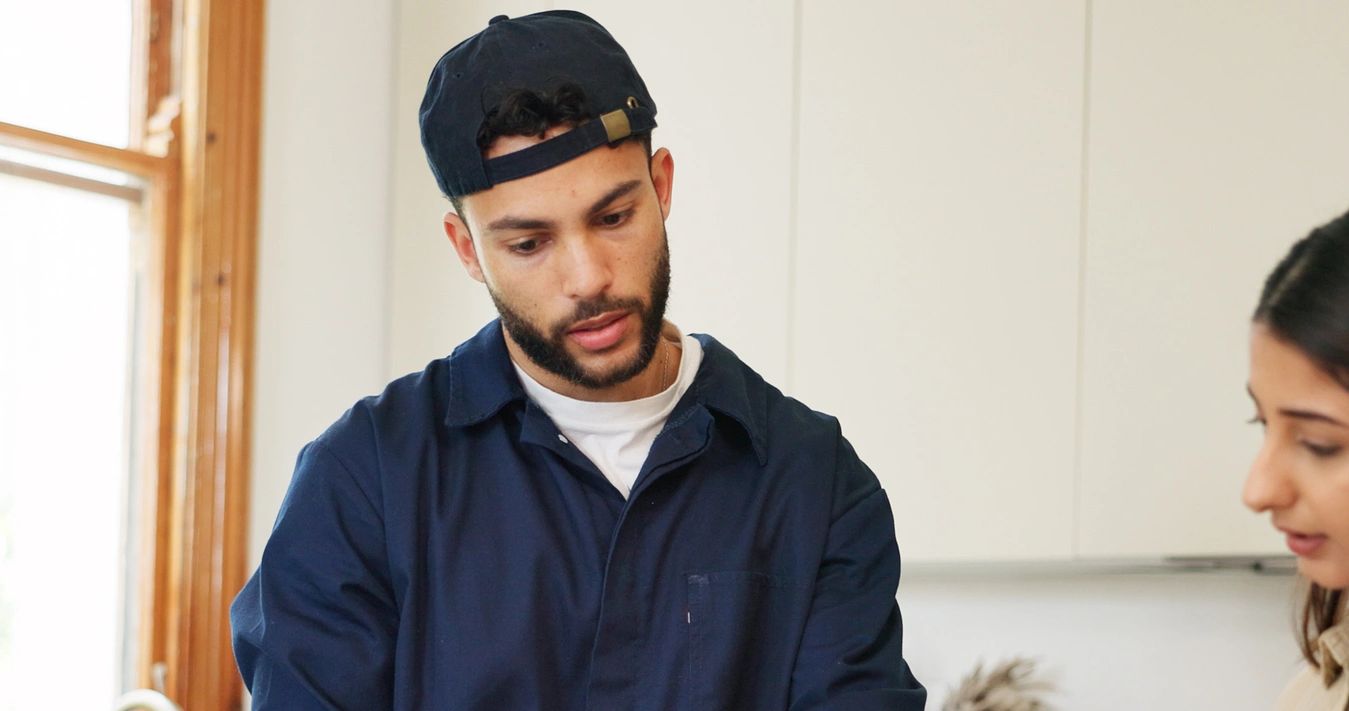 Plumber is consulting with a customer