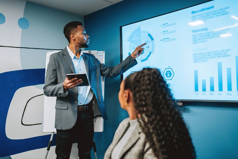 Businessman presenting results on TV