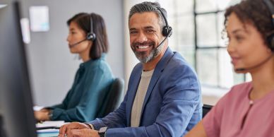 Customer service team working with headsets.
