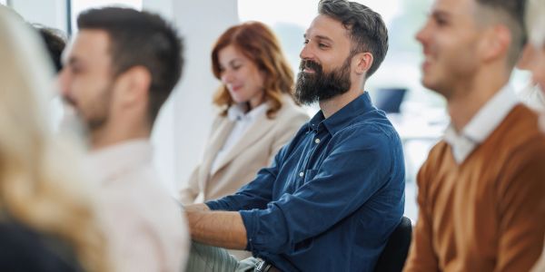 People attentively listening in a meeting or seminar.