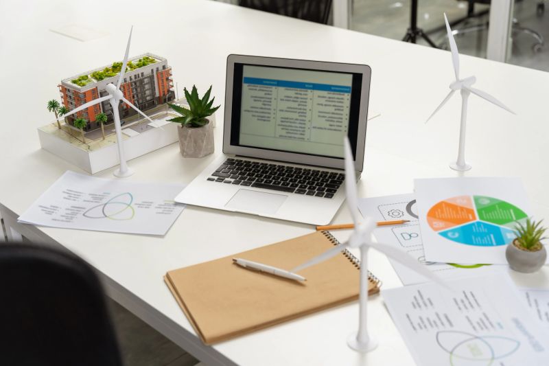 Table in the office. Table in the office with laptop and project documentation on