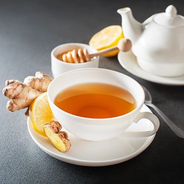 A cup of tea with ginger and lemon.