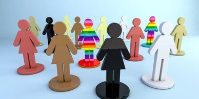 Wooden figures of people showing inclusivity 