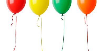 Four colorful balloons against a white background.