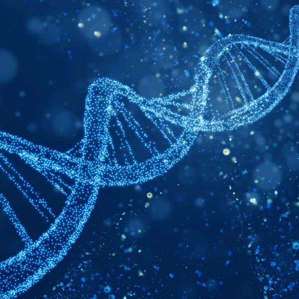 A glowing blue DNA double helix structure on a dark background.