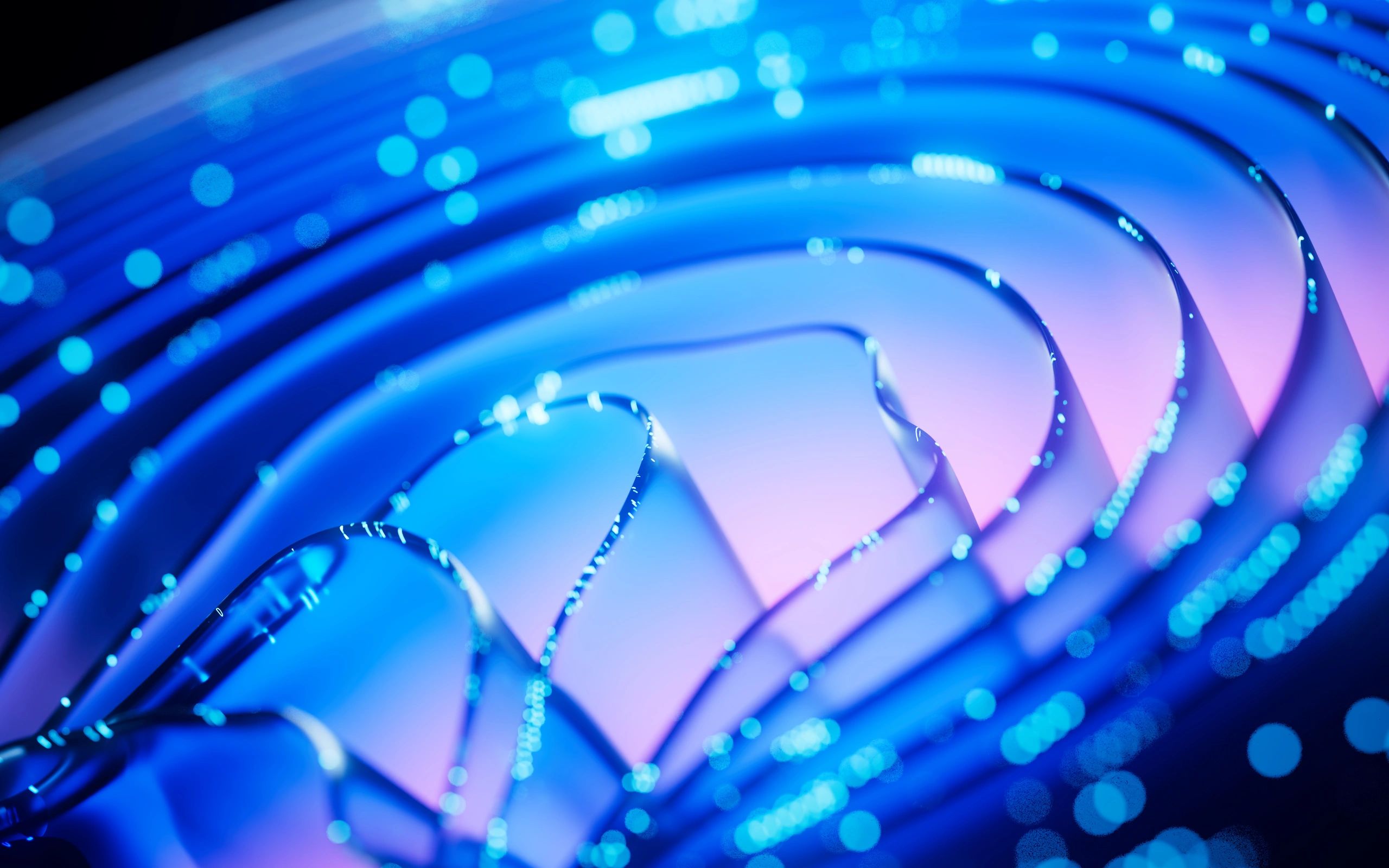 Abstract blue and purple light spirals with glowing bokeh effects.
