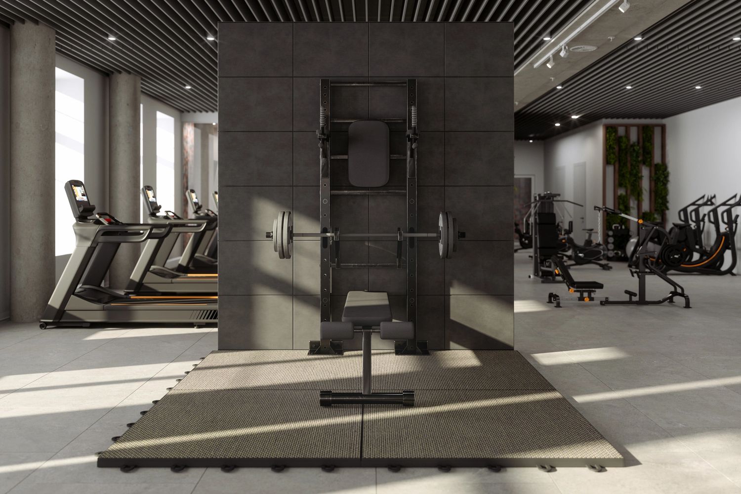 Modern gym with weightlifting equipment and treadmills in a bright, spacious setting.