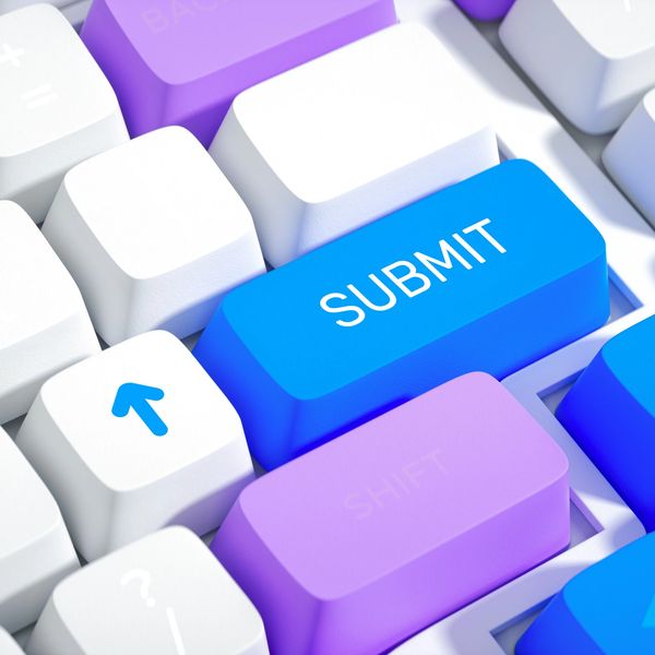Close-up of colorful keyboard with a blue Submit key.