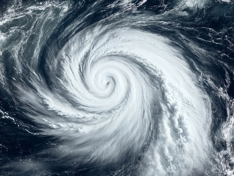 Satellite image of a swirling hurricane over the ocean.