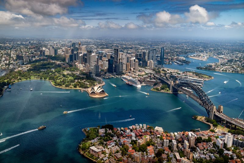 Drone shot of the beautiful Sydney Harbor showing the Opera House and the Harbor Bridge