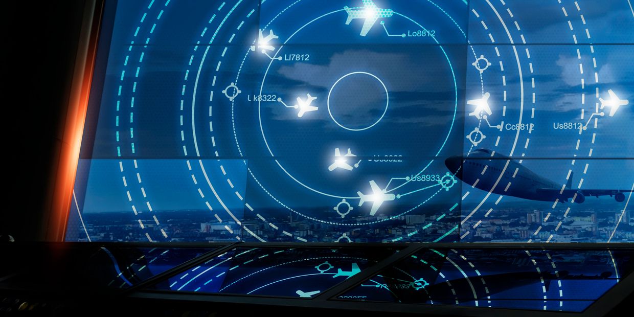 Airport control tower screen showing aircraft radar and flight data.