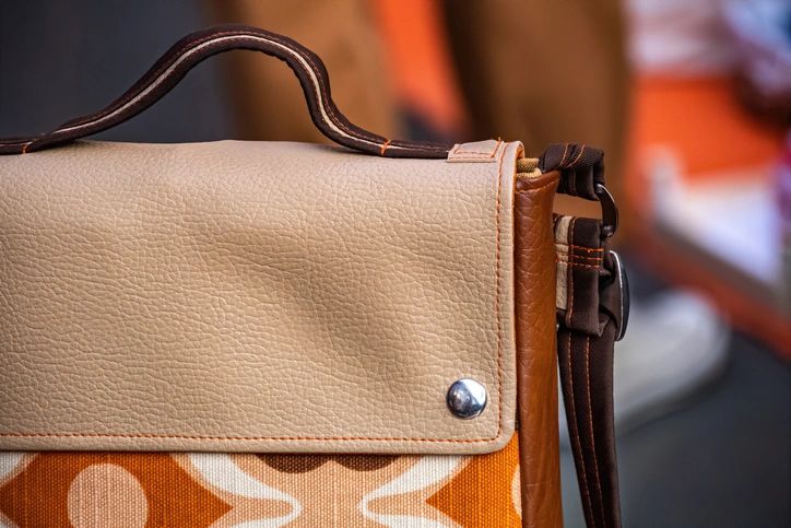 Close-up of leather ladies handbag. Fashion and handmade concept