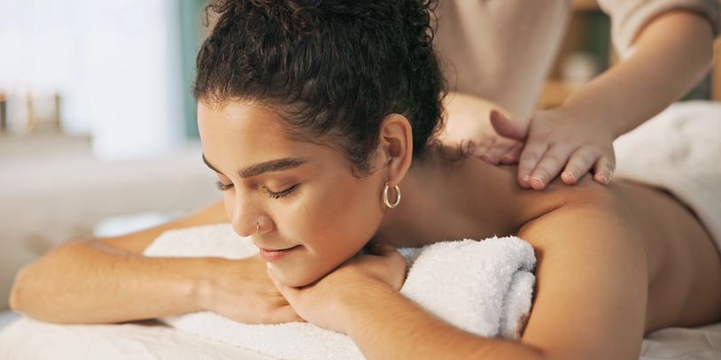 Woman receiving a relaxing back massage.