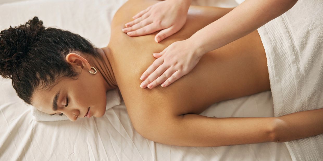 Woman receiving a relaxing back massage.
